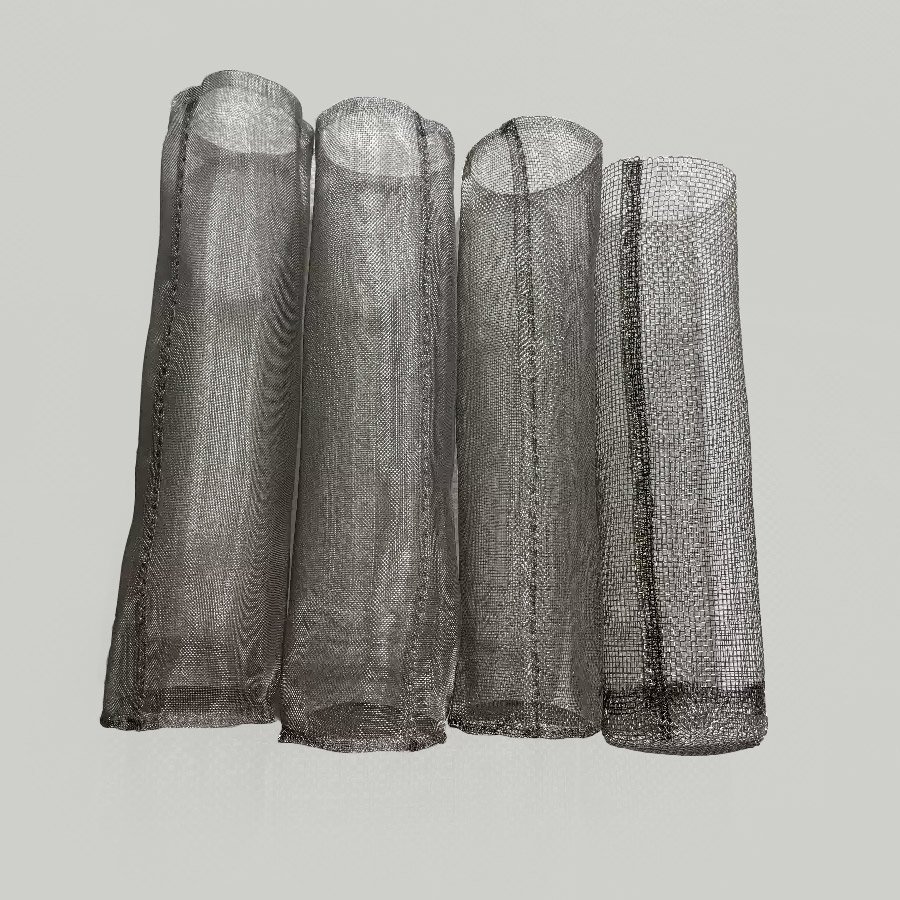 Side view of four sanitary stainless steel mesh filter cylinders with different weave densities and mesh sizes standing upright for comparison