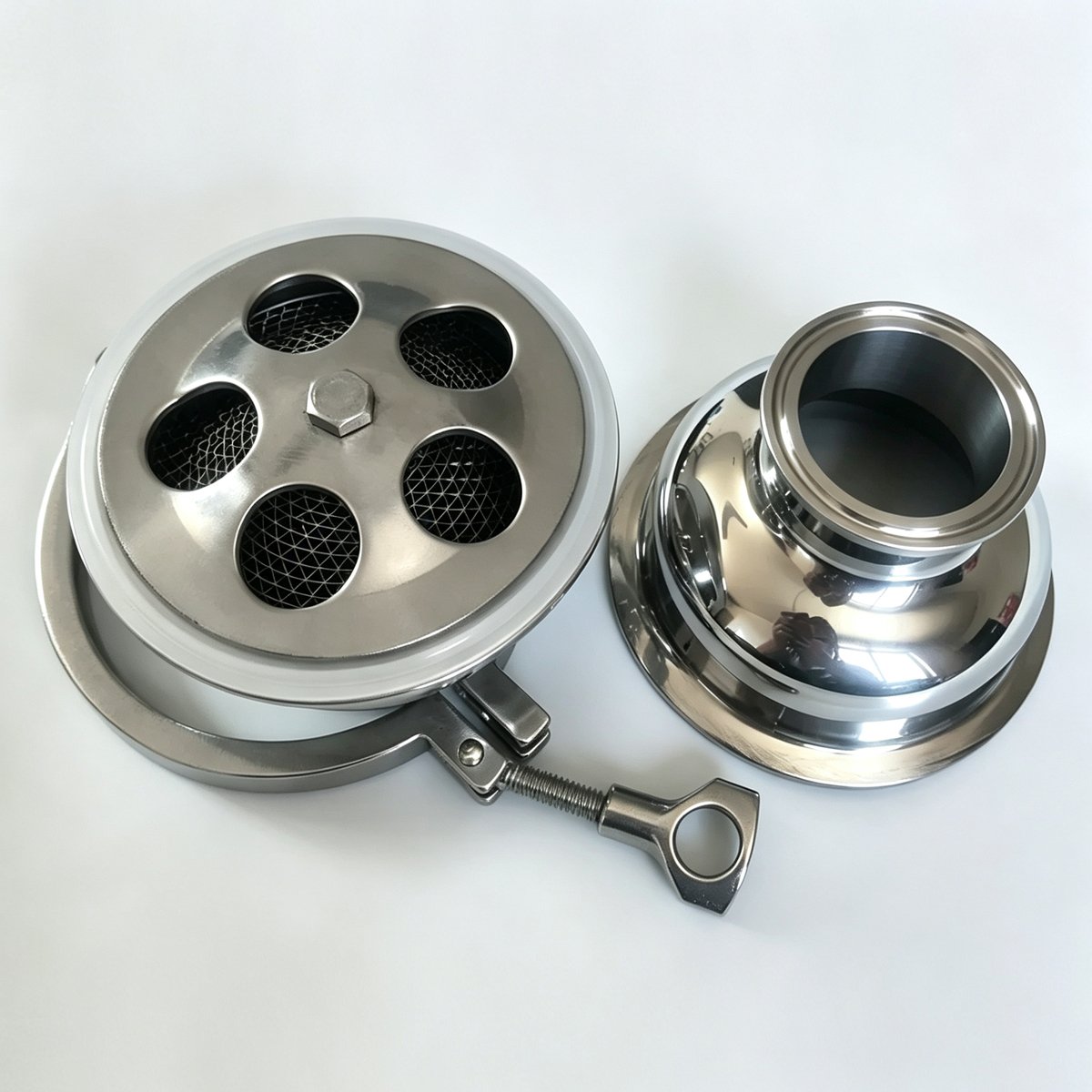 Sanitary 304 stainless steel quick clamp flame arrester disassembled showing mesh flame arrester element and Tri-Clamp body